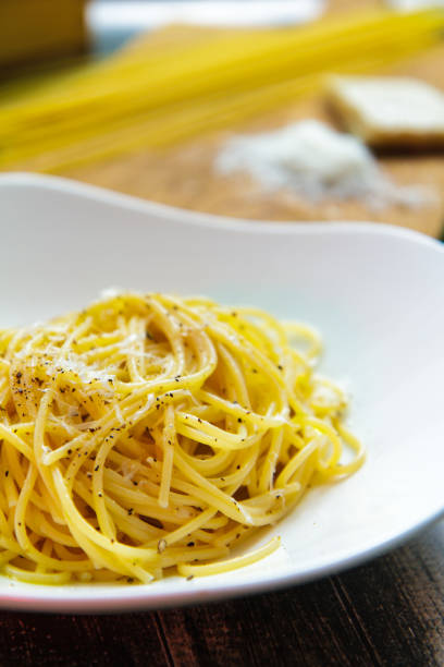 istock Noodles with cheese in a ceramic plate side view 949174344
