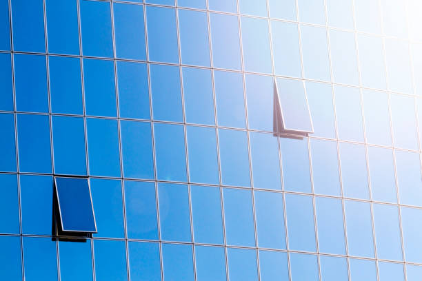 istock clean office windows that reflect the blue sky with sunny hotspot 949174942