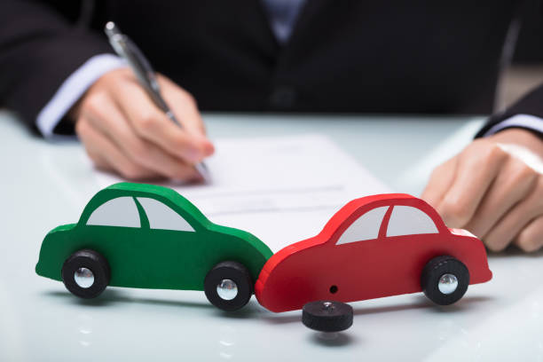 Close-up Of Red And Green Car