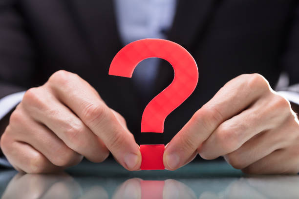 istock Businessperson Holding Question Mark Sign 949178104