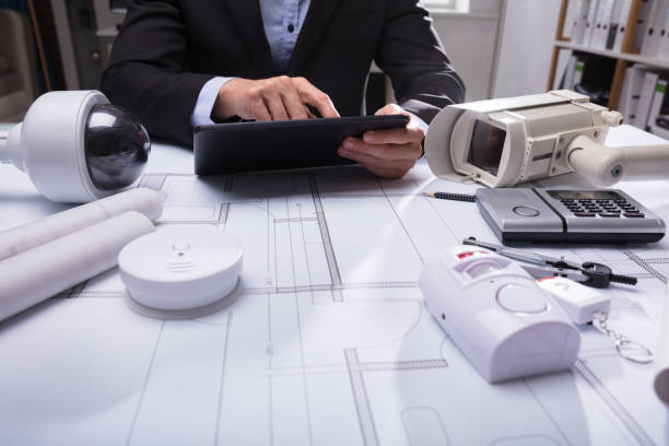 istock Close-up Of Security Equipments On Blueprint 949178174