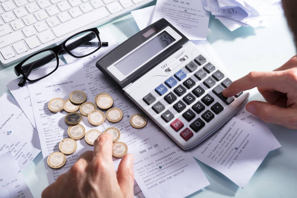 istock Businessperson Calculating Receipt With Calculator 949180612