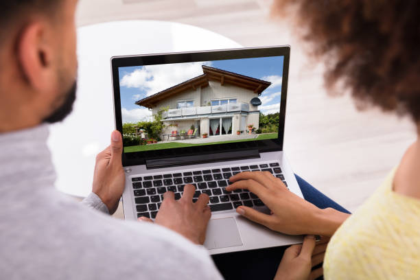 istock Couple Looking At House On Laptop 949185986