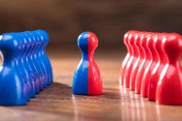 istock Merging Of Red And Blue Pawns 949187064