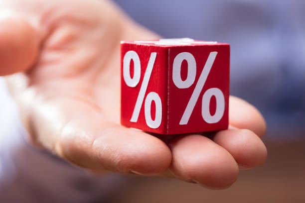 istock Hand Holding Red Block With Percentage Symbol 949187364