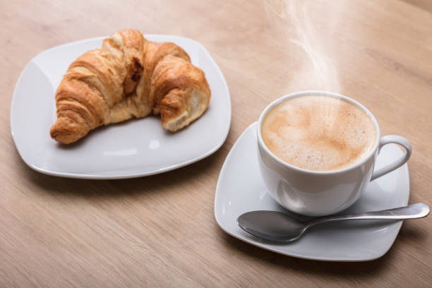istock Croissant And Cup Of Coffee At Breakfast 949187762