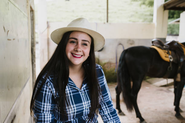 istock Latin cowgirl on the ranch 949190012