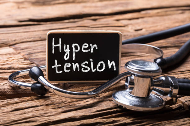 Close-up Of Stethoscope With Slate Showing Hypertension Text Close-up Of Stethoscope With Slate Showing Hypertension Text On Wooden Desk hypertensive photos stock pictures, royalty-free photos & images