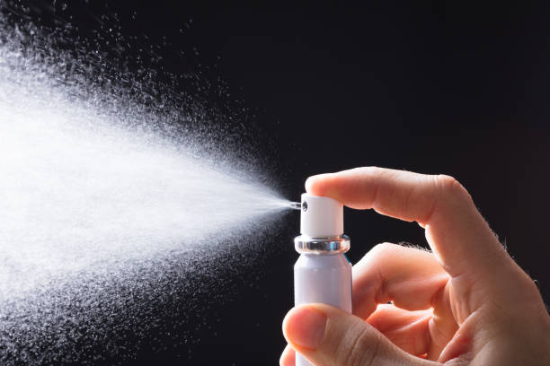 istock Person Spraying Breath Freshener 949190446