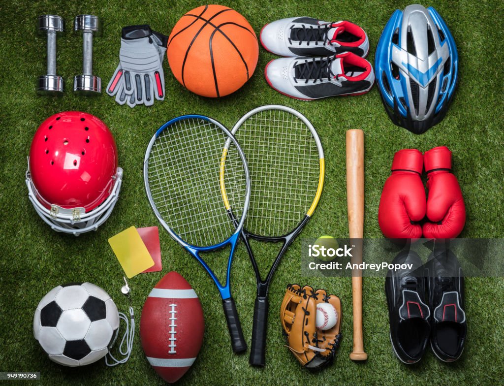 Various Sport Equipments On Grass High Angle View Of Various Sport Equipments On Green Grass Sport Stock Photo