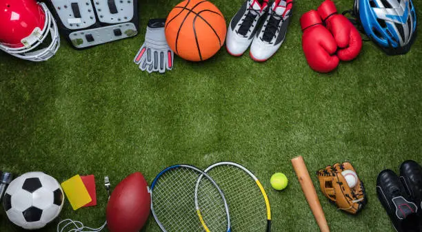 Photo of Various Sport Equipments On Grass