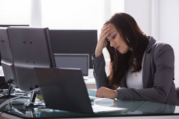 istock Stressed Businesswoman Sitting In Office 949191116