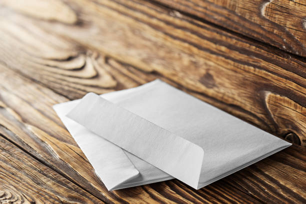 istock Two white envelopes with letters on old wooden dark background. Blanks for the designer. Concepts, ideas for postal services and e-mail. 949195576