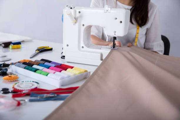 istock Fashion Designer Stitching Cloth On Sewing Machine 949195908