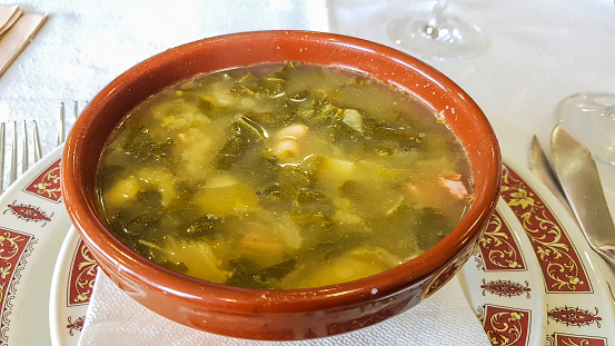 Galician soup in clay bowl