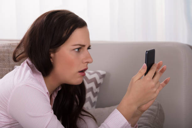 istock Woman Looking At Smartphone 949198730
