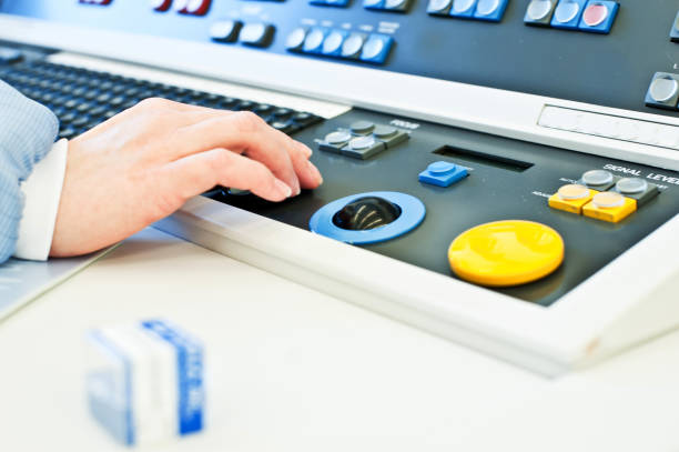 istock Research And Development: Scientist Hand Working On The Console Of A High Resolution Scanning Microscope (SEM) Laboratory / Cleanroom 949198780