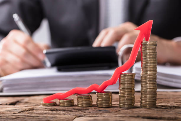 istock Increasing Golden Coins With Red Arrow Showing Upward Direction 949199140