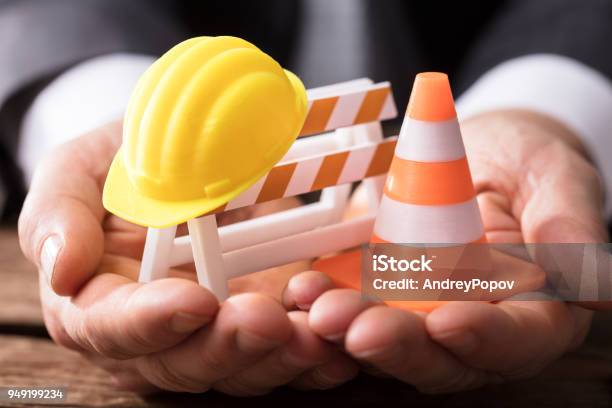 Closeup Of Barricade With Traffic Cone And Hard Hat Stock Photo - Download Image Now