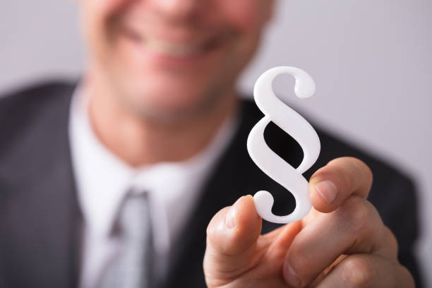 istock Businessperson Holding Paragraph Symbol 949199260