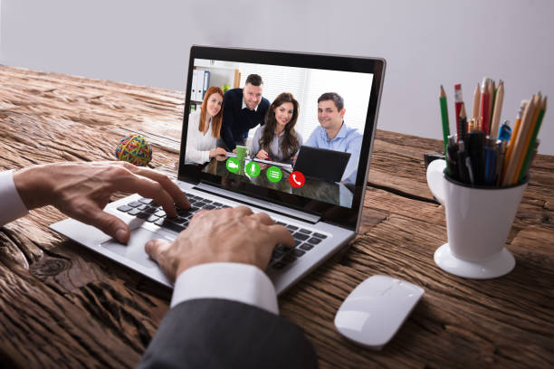 istock Businessperson Video Conferencing With Colleague On Laptop 949199488