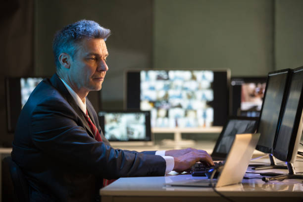 Businessman Looking At CCTV Camera Footage