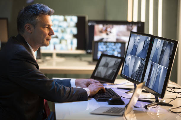 istock Businessman Looking At CCTV Camera Footage 949203160