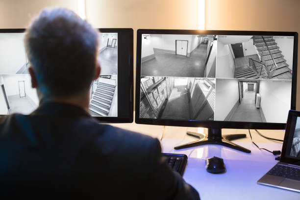 istock Businessman Looking At CCTV Camera Footage 949203164