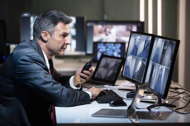 istock Side View Of A Businessman Talking On Walkie Talkie 949205192