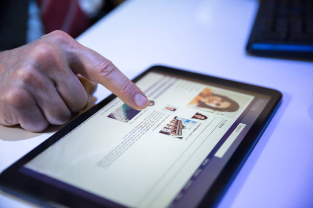 istock Businessperson Using Social Networking Site On Digital Tablet 949207118