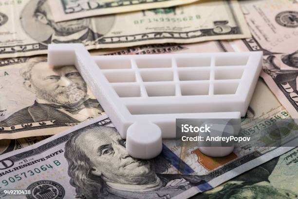 Shopping Cart On Dollar Banknotes Stock Photo - Download Image Now - Sale, Tax, E-commerce