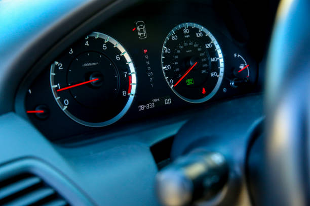Dashboard on a car Close-up view of speedometers and other gauges on a passenger car dashboard close up speedometer odometer stock pictures, royalty-free photos & images