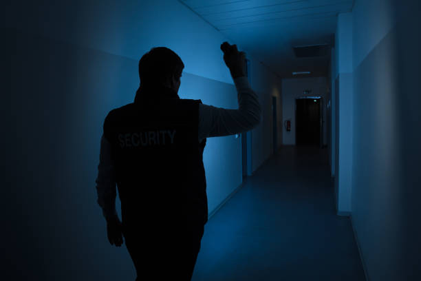 istock Security Guard Standing In Corridor Of The Building 949212660
