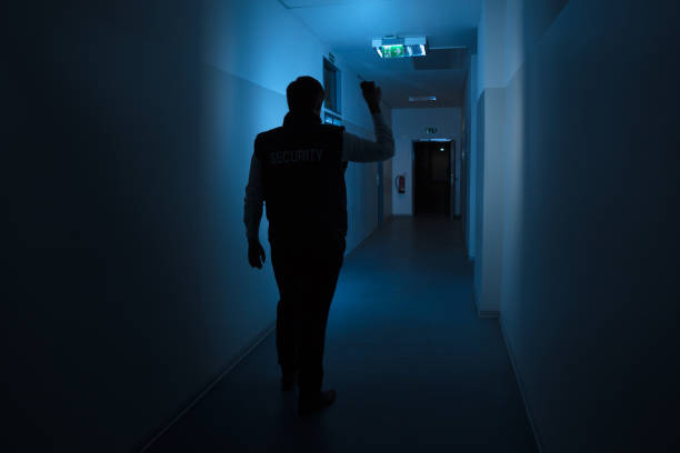 istock Security Guard Standing In Corridor Of The Building 949212668