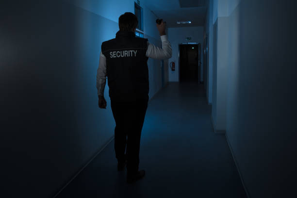 istock Security Guard Standing In Corridor Of The Building 949212672