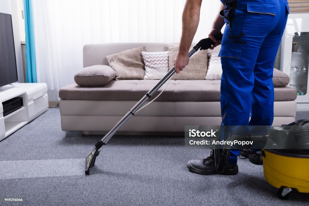 Janitor Cleaning Carpet Janitor's Hand Cleaning Carpet With Vacuum Cleaner Cleaning Stock Photo