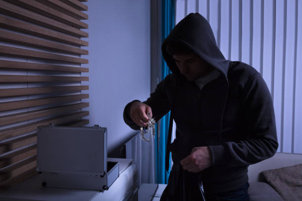 istock Robber Standing In Living Room 949216360