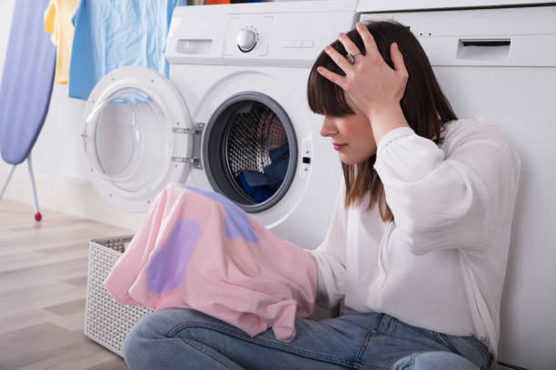 istock Woman Looking At Stained Cloth 949218736