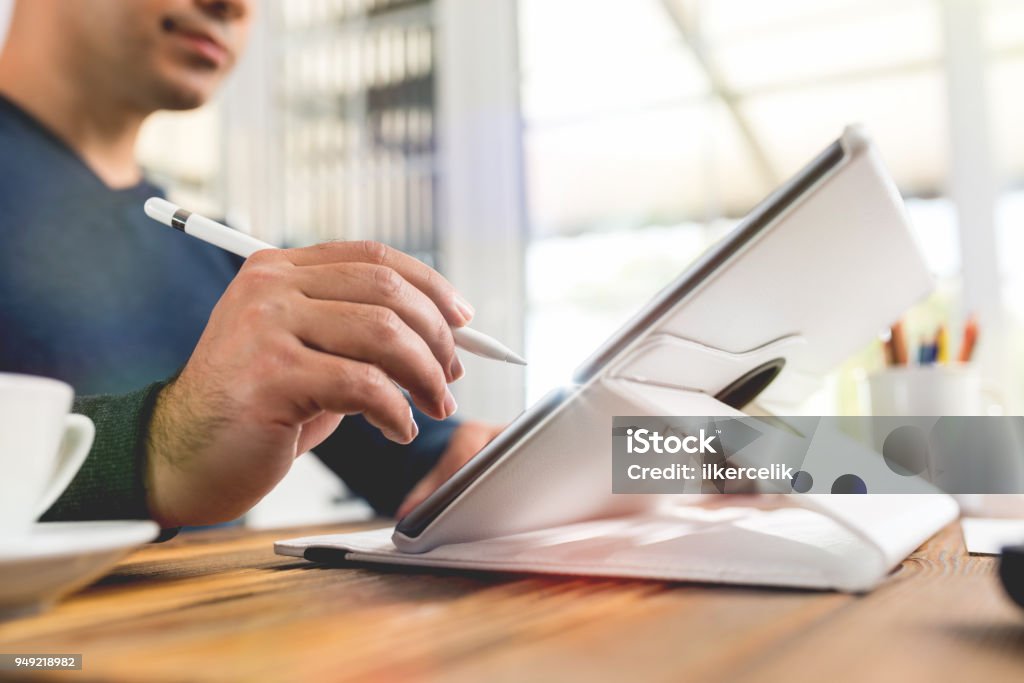 Writing or Signing on Digital Document Using Electronic Pad and Stylus Pen Signing Stock Photo