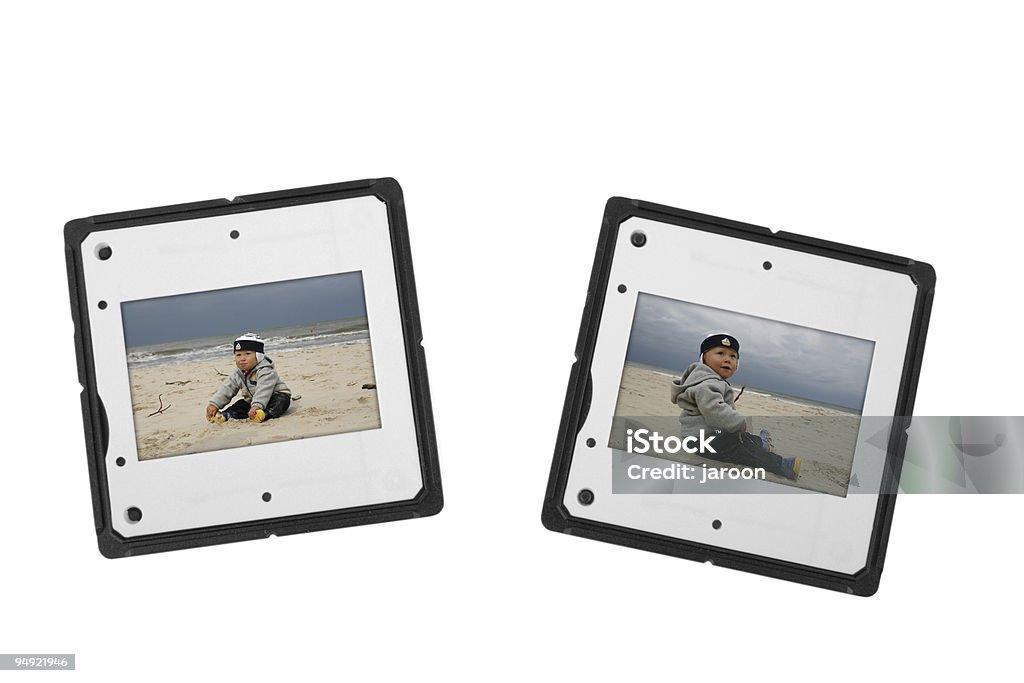 Dos toboganes con niño en la playa - Foto de stock de Borde libre de derechos