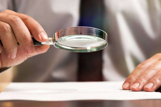 istock Businessman Reading Contract Details Before Signing 949219466