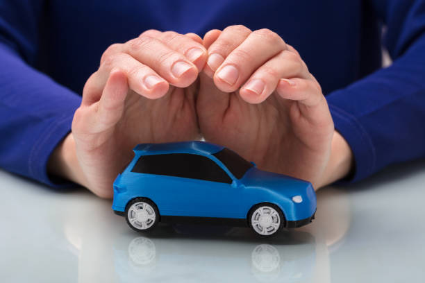 istock Person Protecting Small Car 949219542