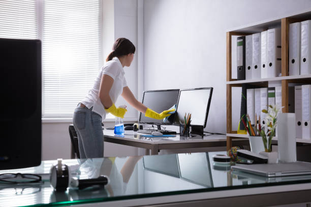 istock Woman Cleaning Computer In Office 949220058