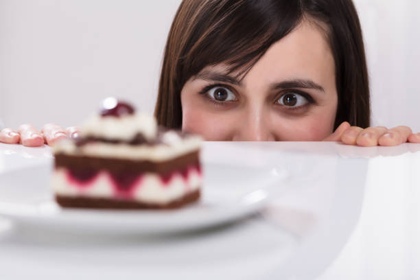 istock Woman Craving For Slice Of Cake 949220390