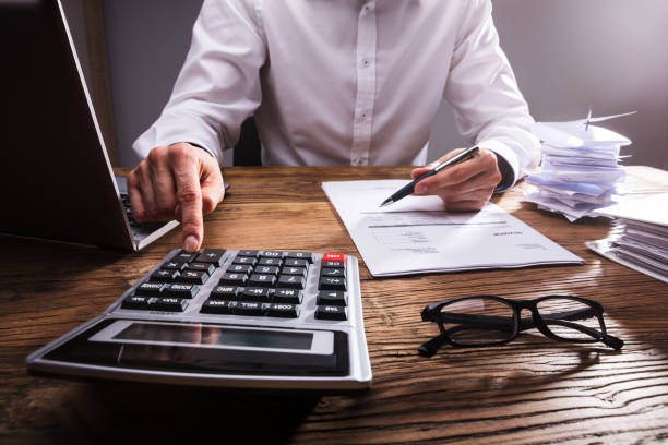 istock Businessperson Calculating Bill With Calculator 949220636