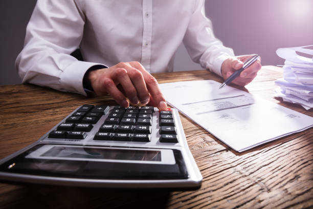istock Businessperson Calculating Bill With Calculator 949220644