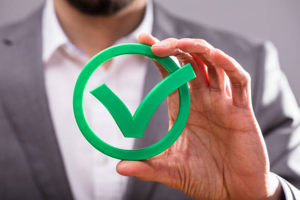 istock Businessperson Holding Check Mark Icon 949220948