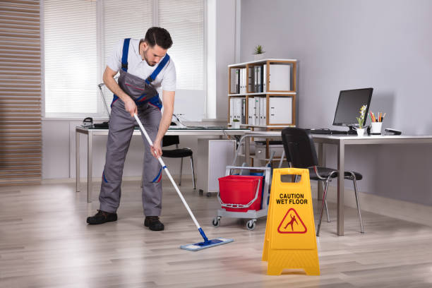istock Man Cleaning Hardwood Floor In Office 949224580