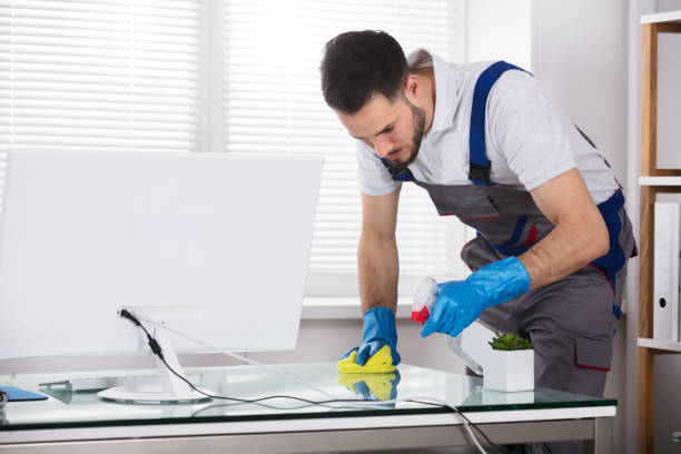 istock Male Worker Cleaning Office Desk 949224698