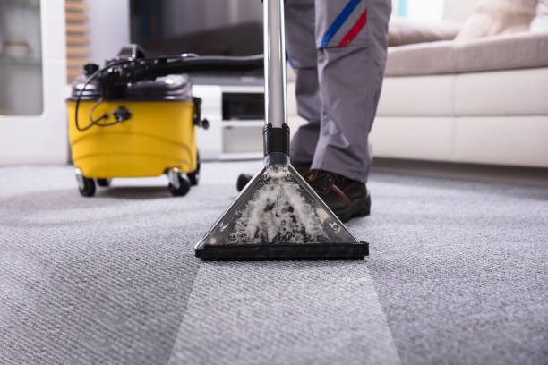 istock Person Cleaning Carpet With Vacuum Cleaner 949224806